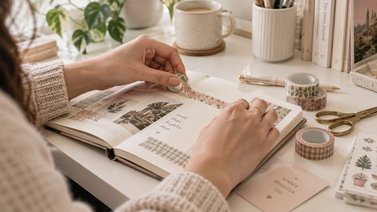 Washi tape being used to decorate a journal page